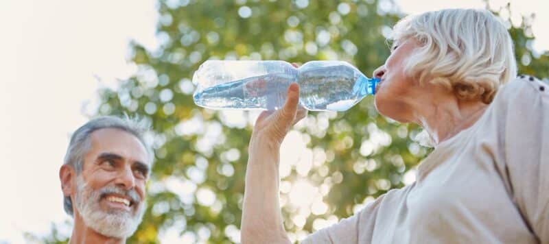 aging couple drinking water